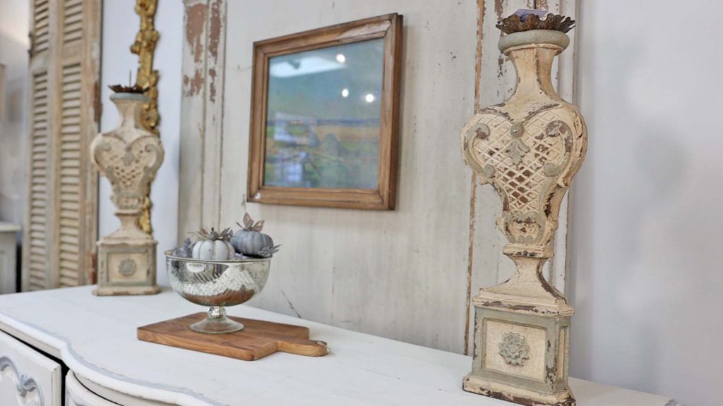 Large French country decor chippy rustic candlesticks found at Village Antiques, styled by Amitha Verma.