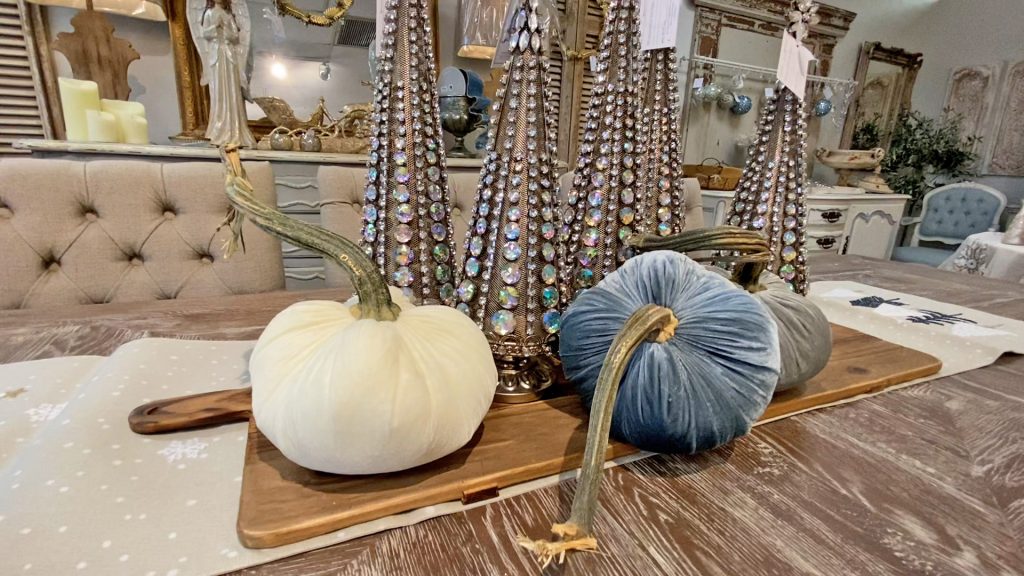Amitha Verma uses the empty pockets in her falliday table centerpiece to include her line of velvet pumpkins. 