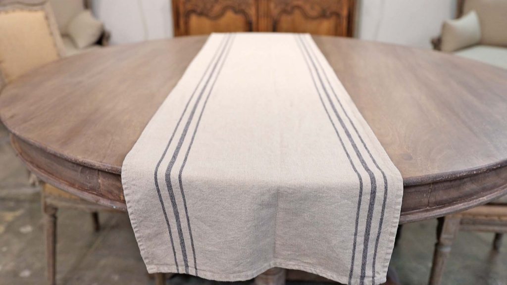 Non-season specific linen table runner styled by Amitha Verma at Village Antiques in Houston, TX.