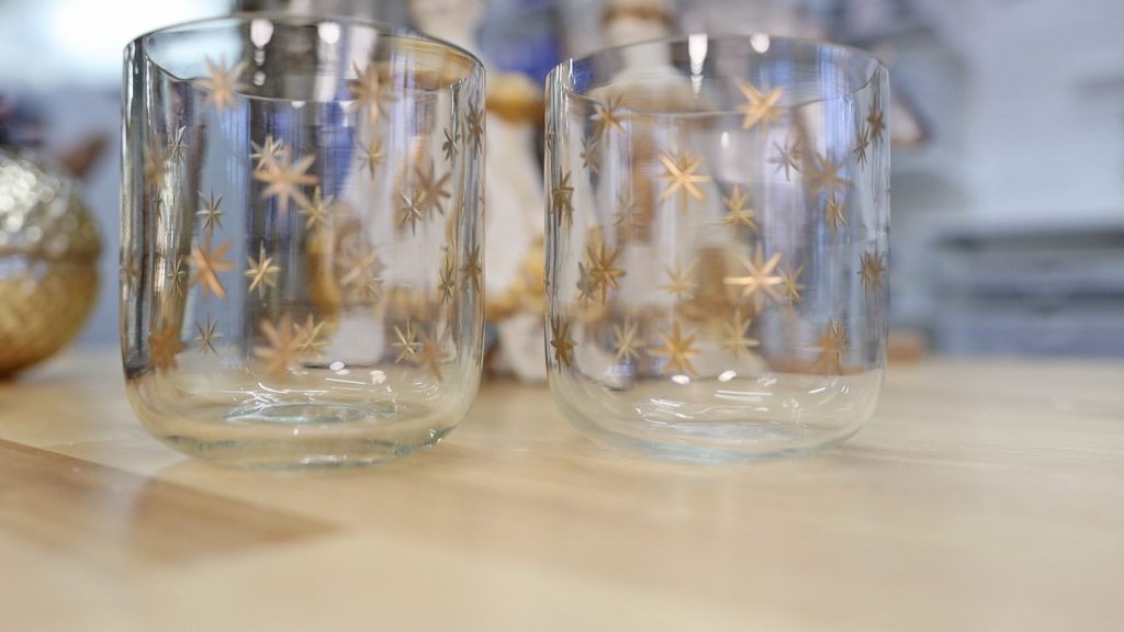 Amitha Verma uses medium sized glass votives with gold stars on her surface tops to add in subtle seasonal decor to her home and her shop, Village Antiques.