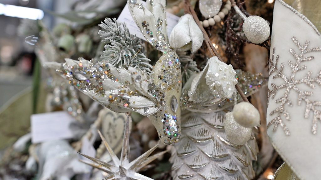 The last piece that Amitha Verma put on her French country Christmas tree was a whitewashed bird with glitter and jeweled details. 