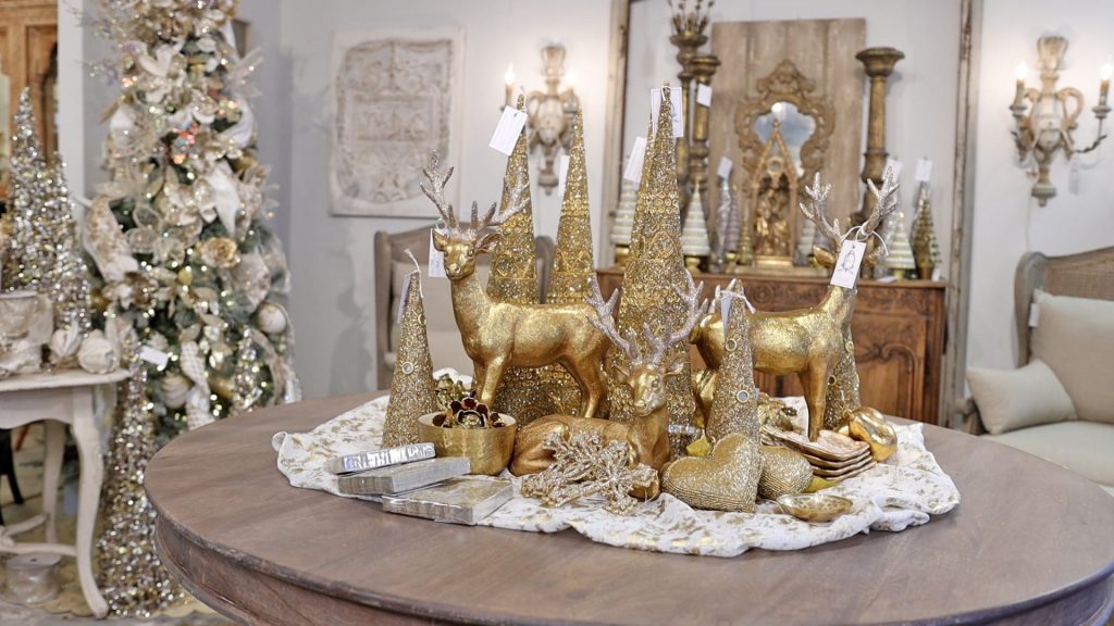 Amitha Verma’s first quick farmhouse Christmas decor idea when it’s too late for a tree is to create a Christmas village inspired tablescape.