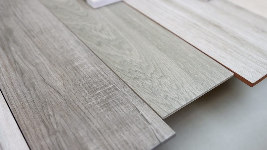 The gray wooden texture tiles that Neal Verma loved for the modern farmhouse apartment reno.