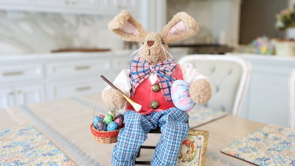 Amitha Verma uses a handmade, artisan-crafted Easter rabbit that is new to Village Antiques for Spring 2022 as the main decor to build her centerpiece around.