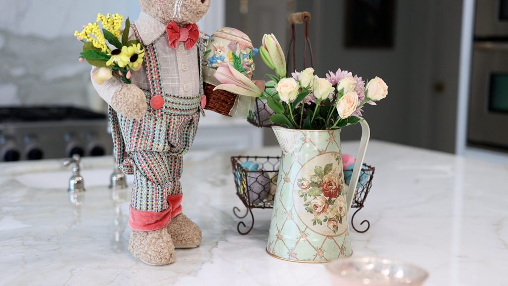 Amitha Verma adds fresh flowers to her pitcher to create the French country farmhouse Easter style.