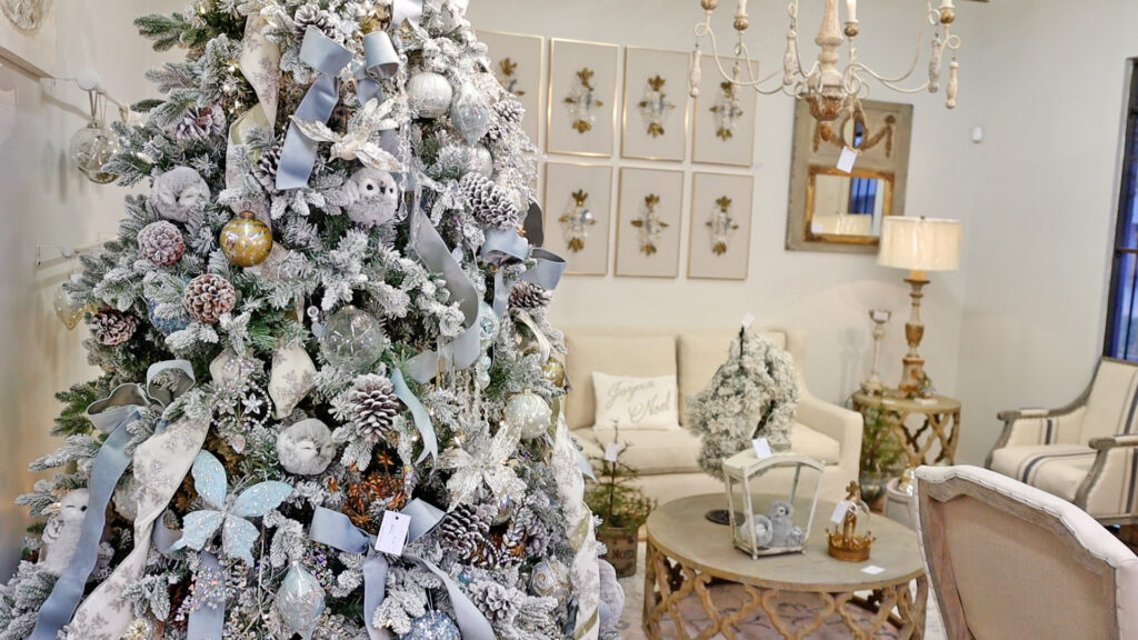 Big and full Christmas trees are a major Christmas décor trend of 2022. Amitha Verma has these styles of trees at her store in Houston, Village Antiques.
