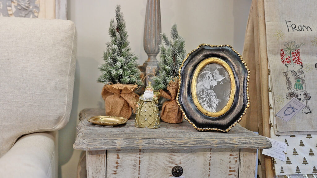 Amitha Verma repeated the natural elements on her side tables with mini trees and a pop of gold with a small whitewashed and mirrored tray, and tiny Santa.