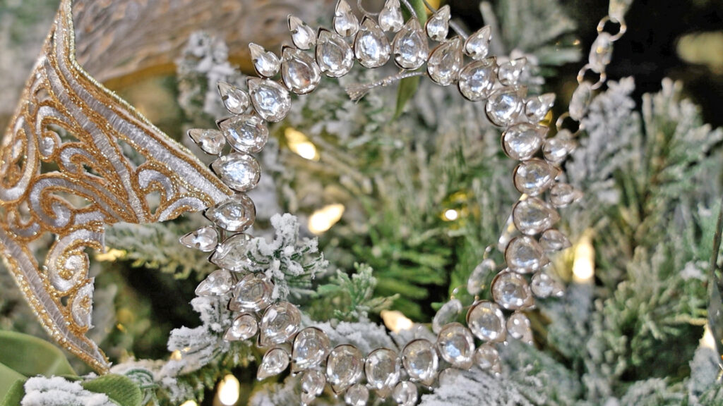  Amitha Verma sprinkled jeweled garland ornaments all throughout the silver and gold tree.