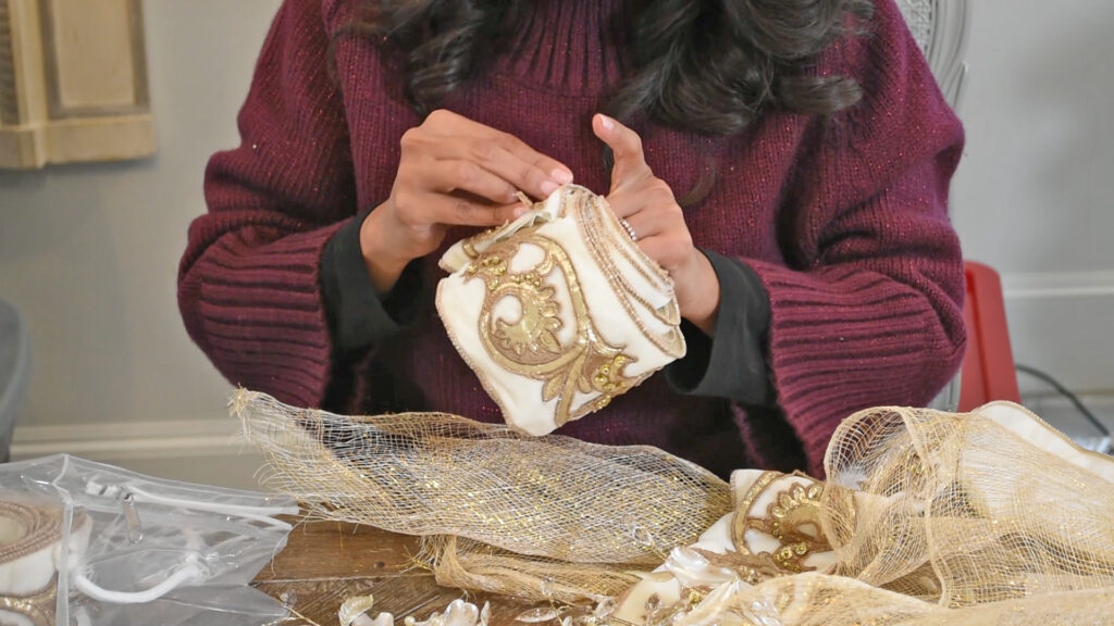 While organizing after Christmas, Amitha Verma irons and rolled her ribbons before storing them away.